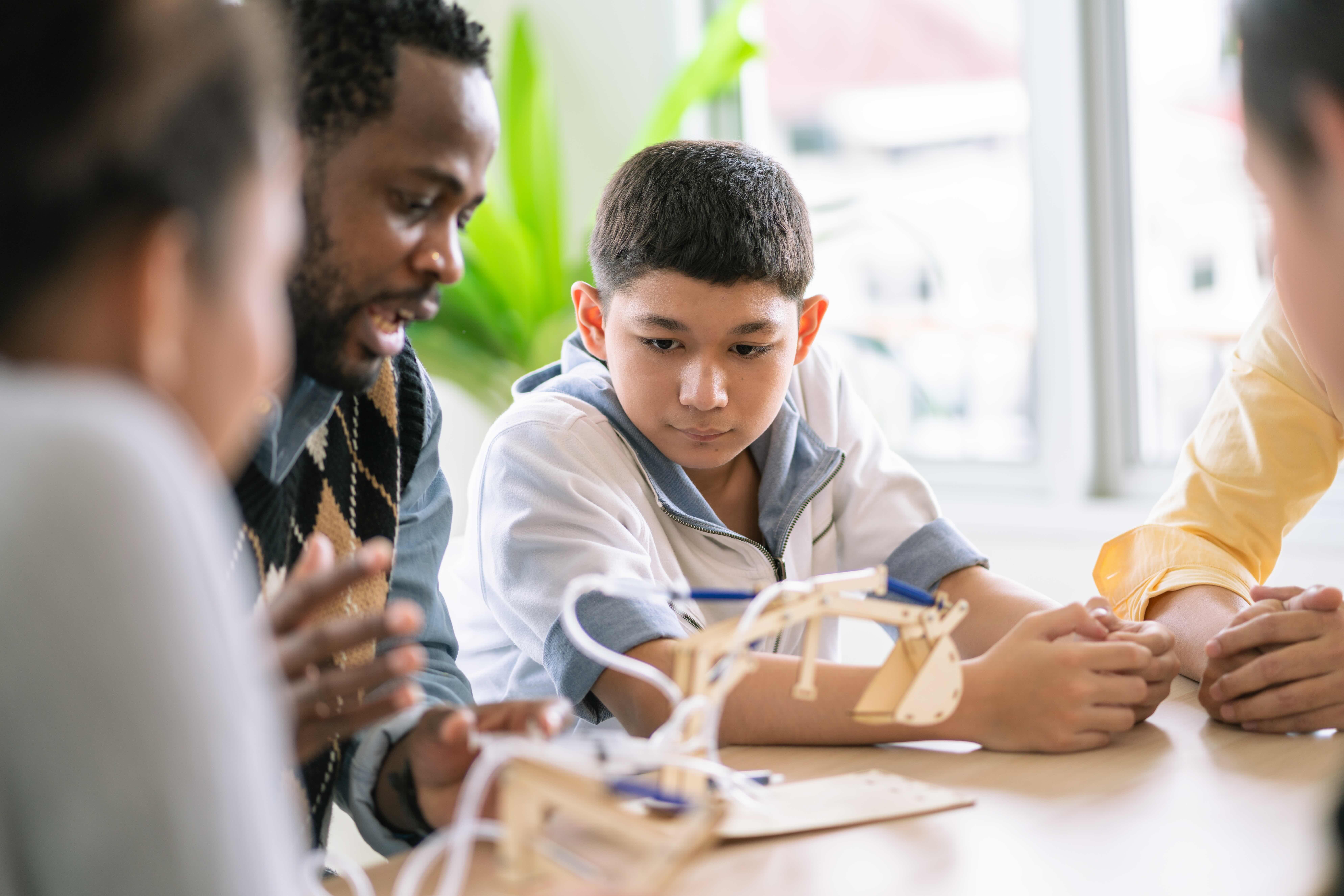 Diverse students learning STEM together